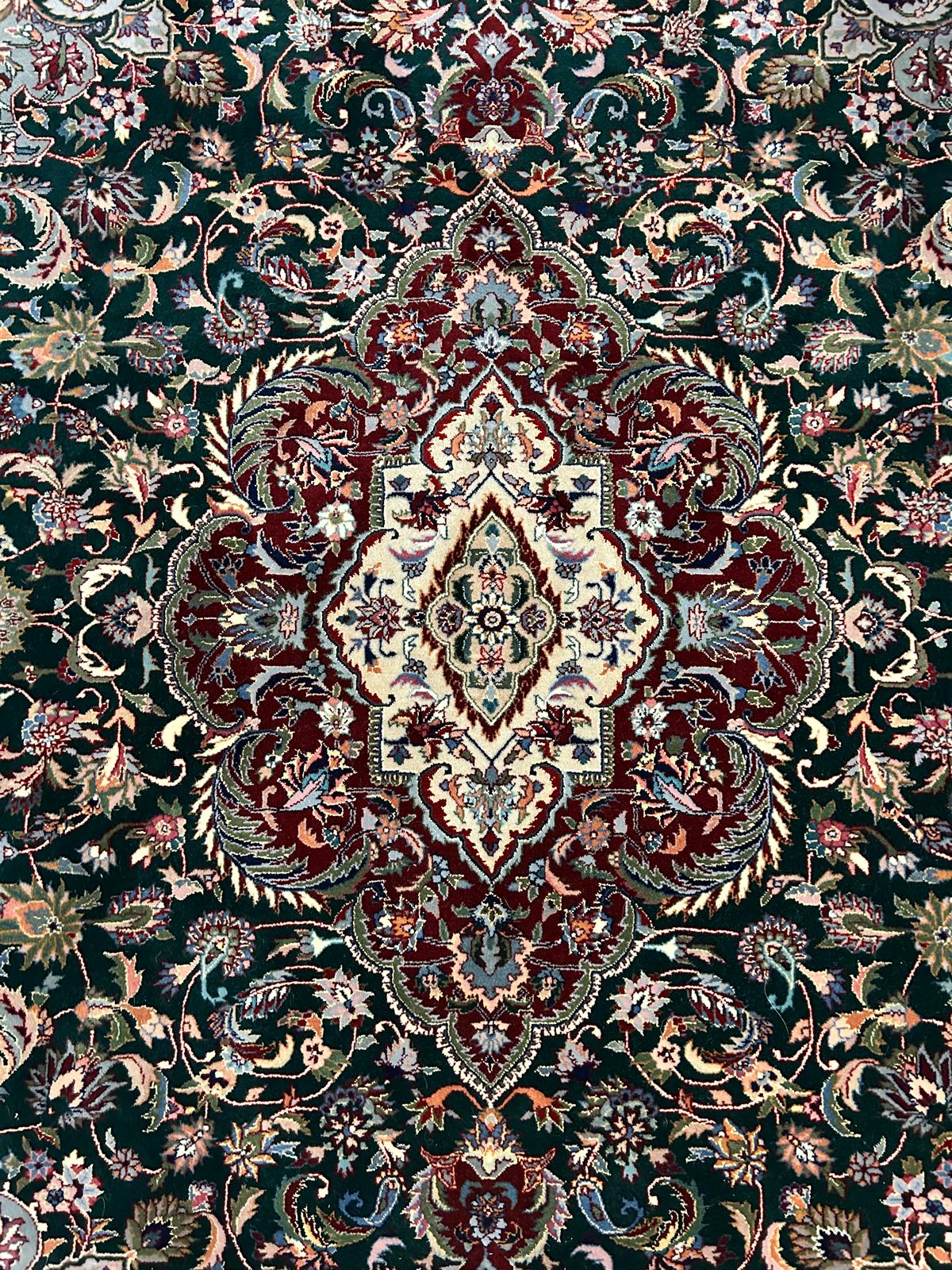 hand-knotted wool green and red kashan rug