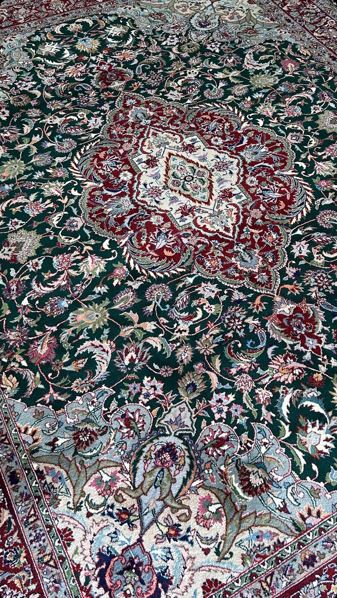 hand-knotted wool green and red kashan rug