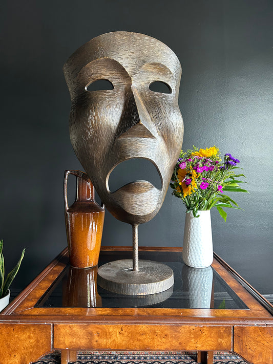 large bronze dramatic mask